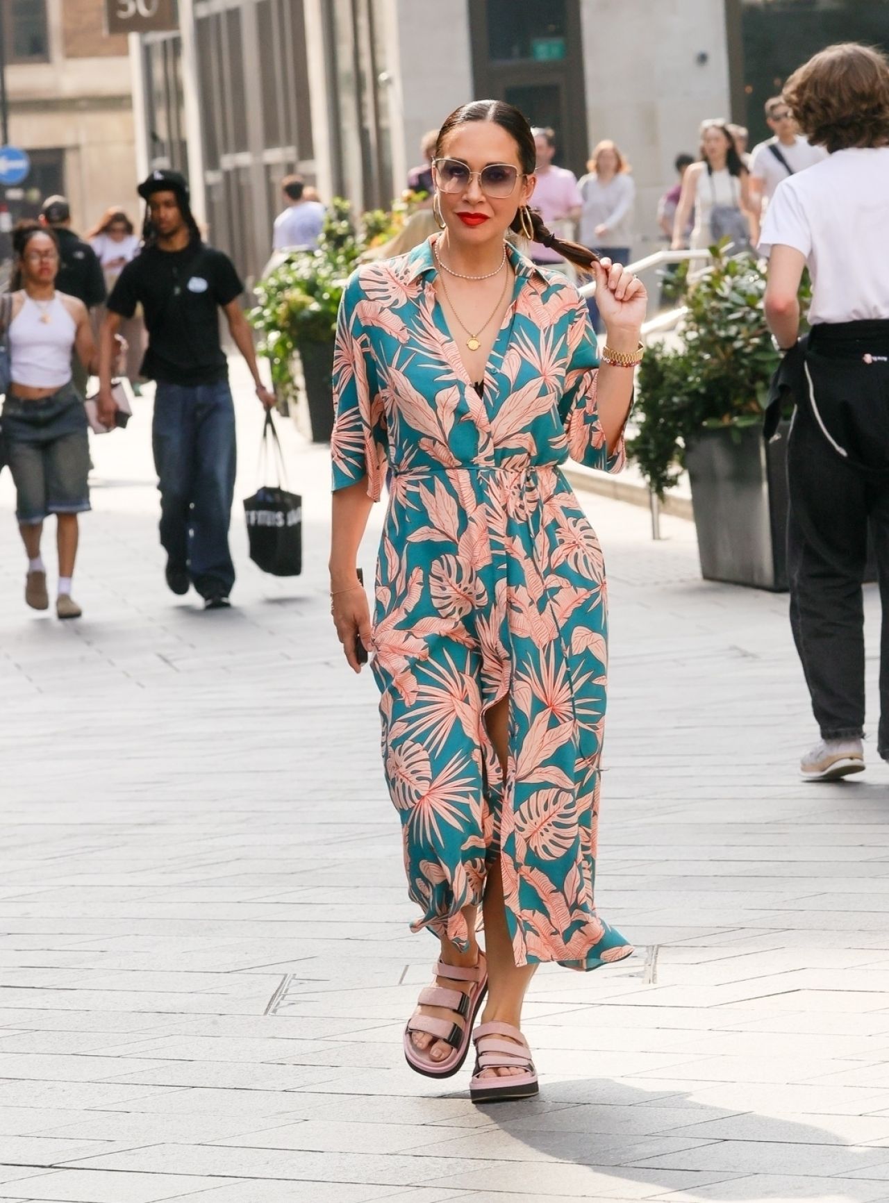 MYLEENE KLASS WEARING A FLORAL DRESS AND SANDALS IN LONDON